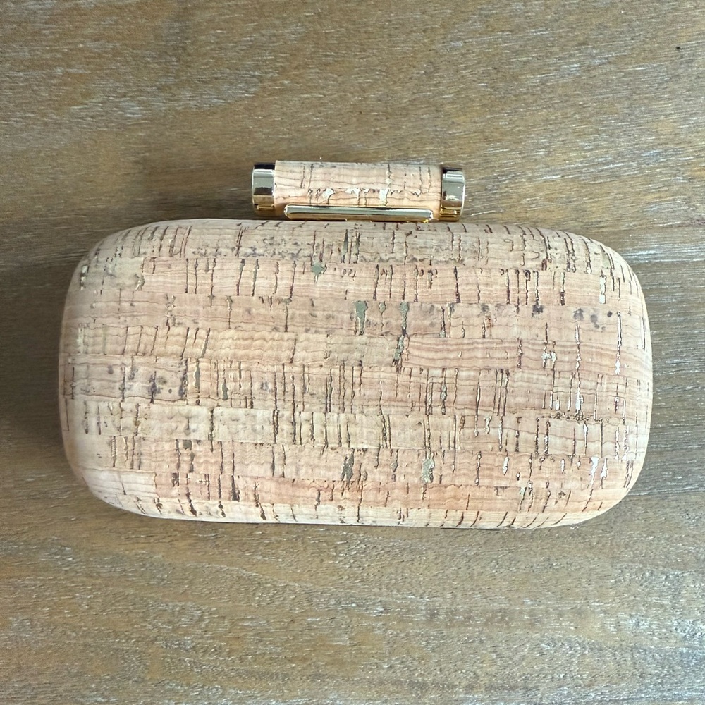 INC cork clutch with gold accents